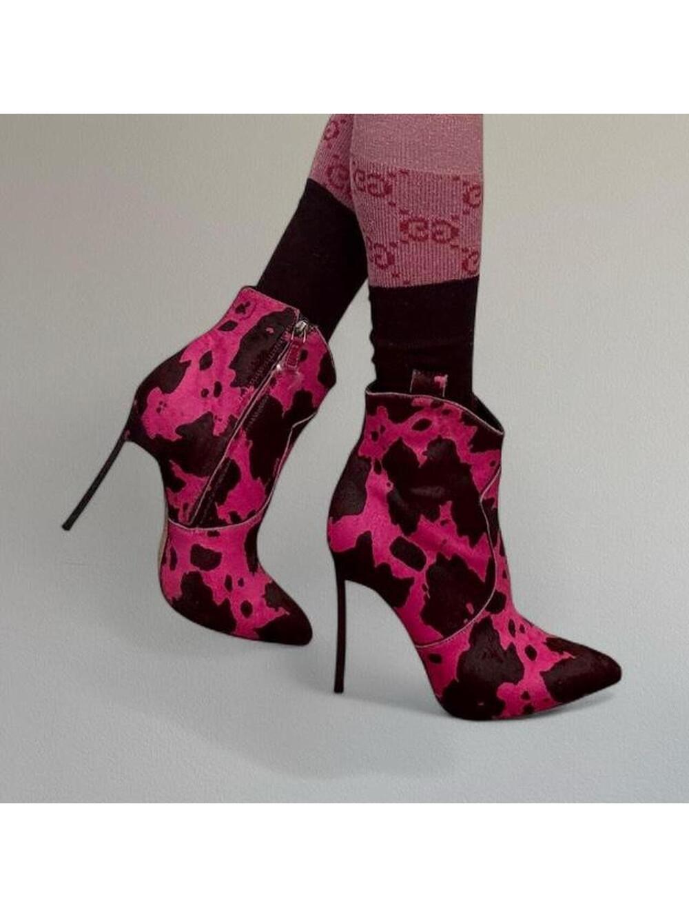 Casadei cow print pony hair boots.